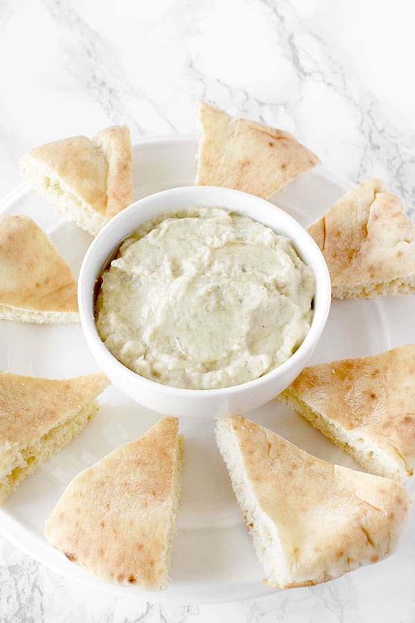 Baba Ghanoush on a plate with pita