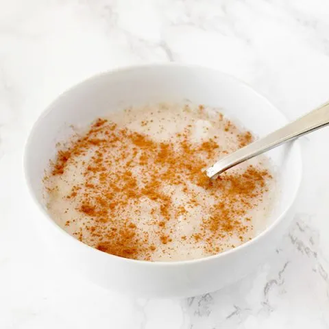 Semolina Porridge sprinkled with cinnamon in a bowl on a counter