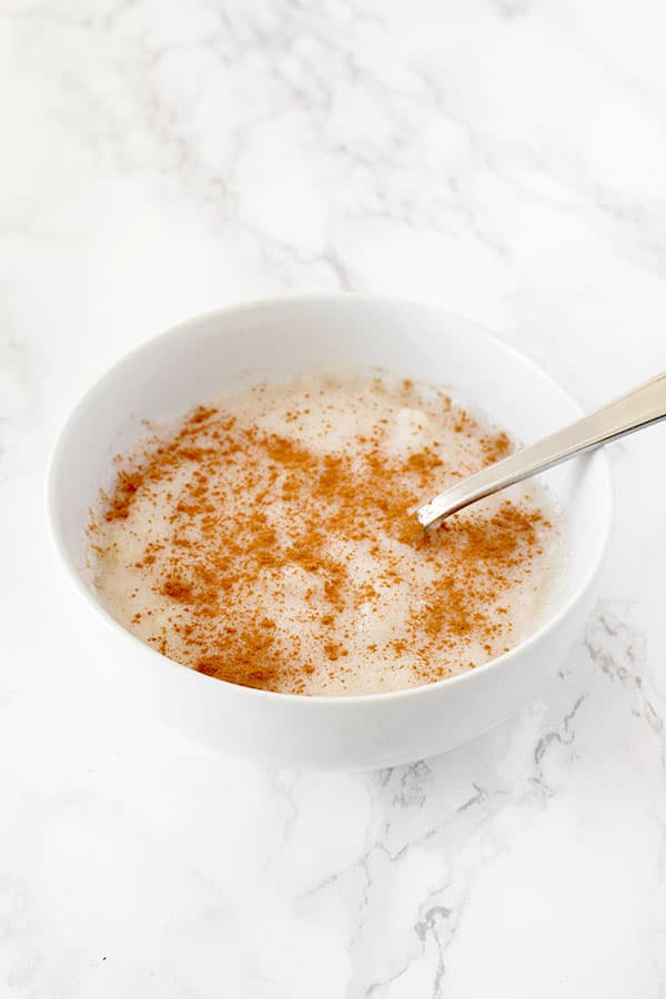 Semolina Porridge sprinkled with cinnamon in a bowl on a counter