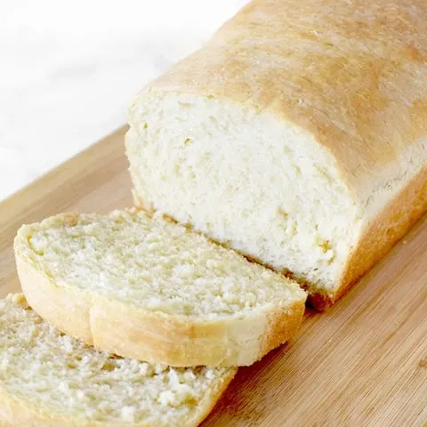 sliced loaf of white bread on a cutting board