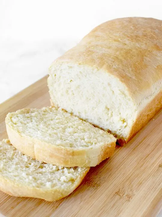 sliced loaf of white bread on a cutting board