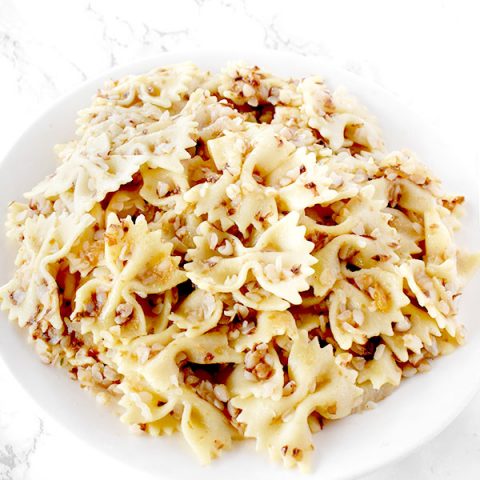 Kasha Varnishkes on a white plate on a white counter
