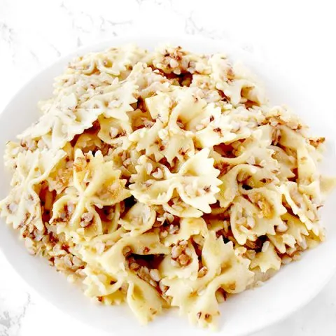 Kasha Varnishkes on a white plate on a white counter