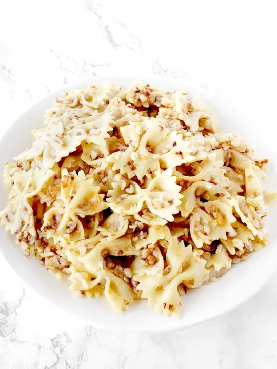 Kasha Varnishkes on a white plate on a white counter