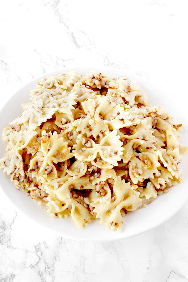 Kasha Varnishkes on a white plate on a white counter
