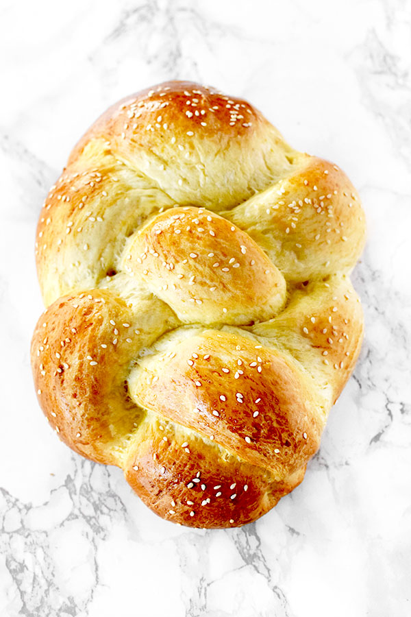 Challah bread on a white marble counter