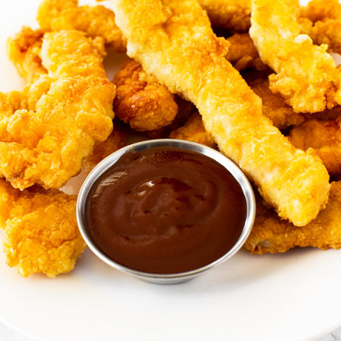 Fried Chicken Strips with ketchup on a plate