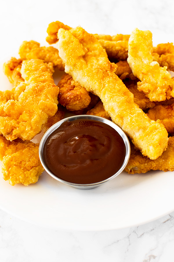 Fried Chicken Strips with ketchup on a plate