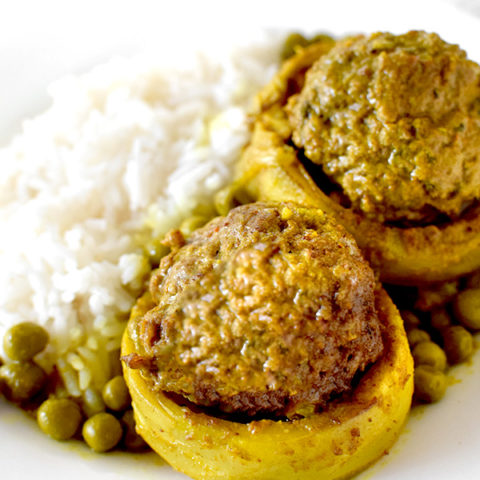 Stuffed Artichoke Bottoms on a Plate with rice and peas