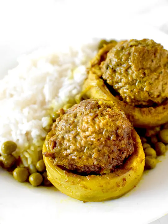 Stuffed Artichoke Bottoms on a Plate with rice and peas