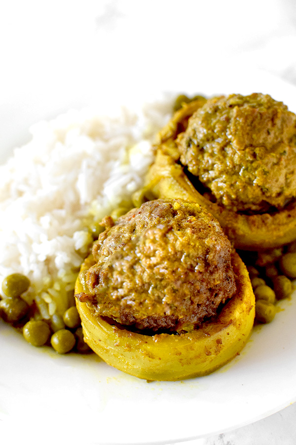 Stuffed Artichoke Bottoms on a Plate with rice and peas