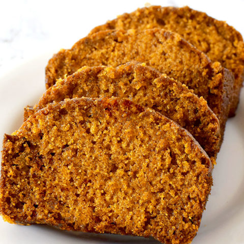 slices of dairy free pumpkin bread on a white plate