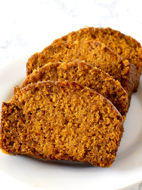 slices of dairy free pumpkin bread on a white plate