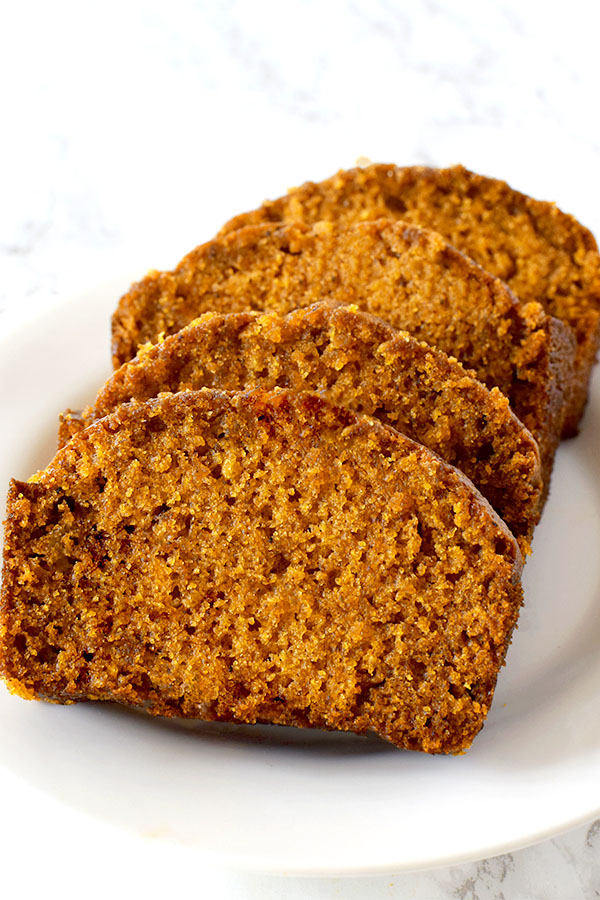 slices of dairy free pumpkin bread on a white plate