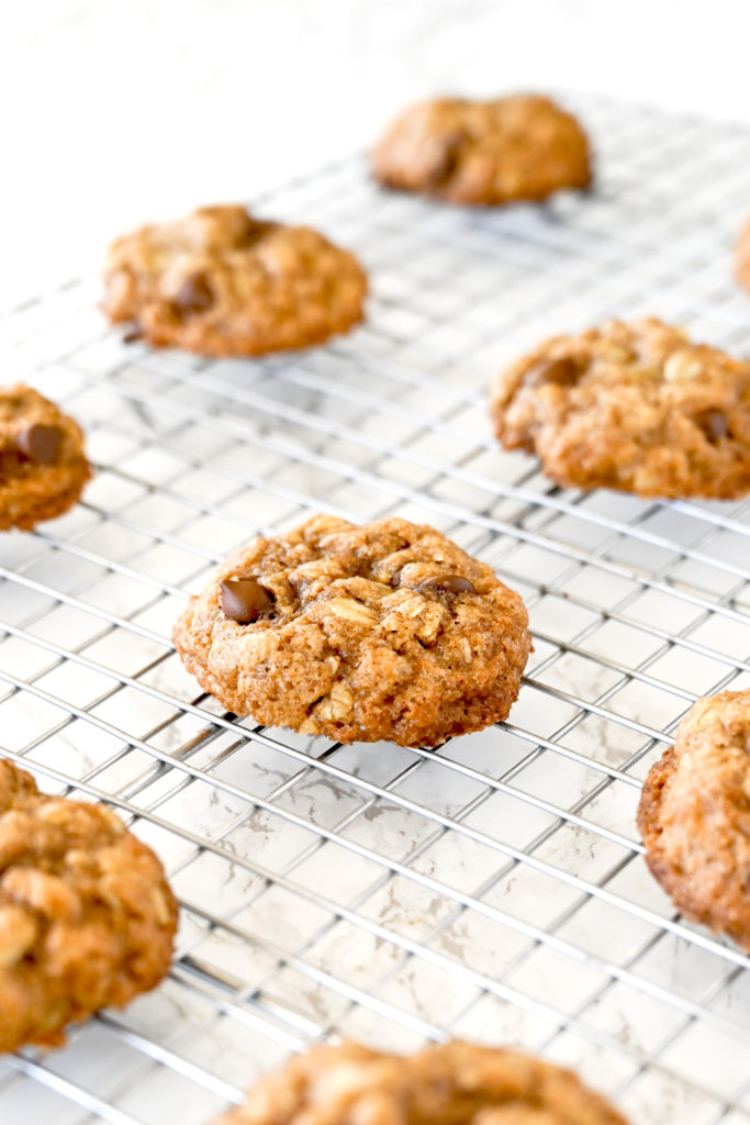 Chocolate chip oatmeal cookies on a cooling rack