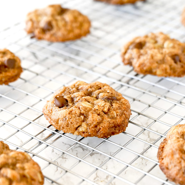 Chocolate chip oatmeal cookies on a cooling rack