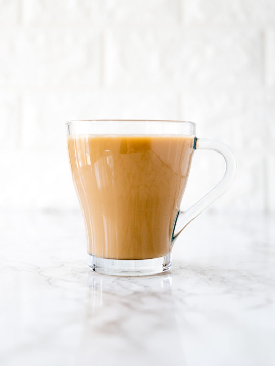 coffee with coconut milk on a white marble counter