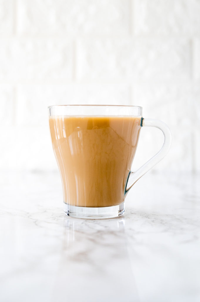 coffee with coconut milk on a white marble counter