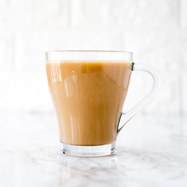 coffee with coconut milk on a white marble counter