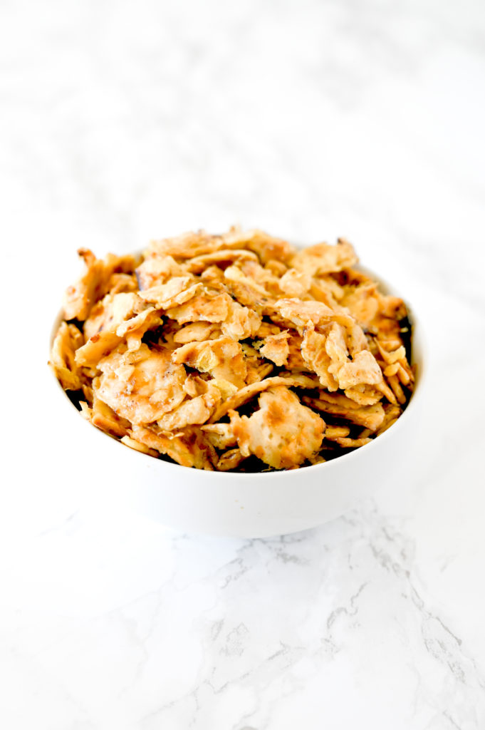 Matzo Brei in a white bowl on a white marble counter