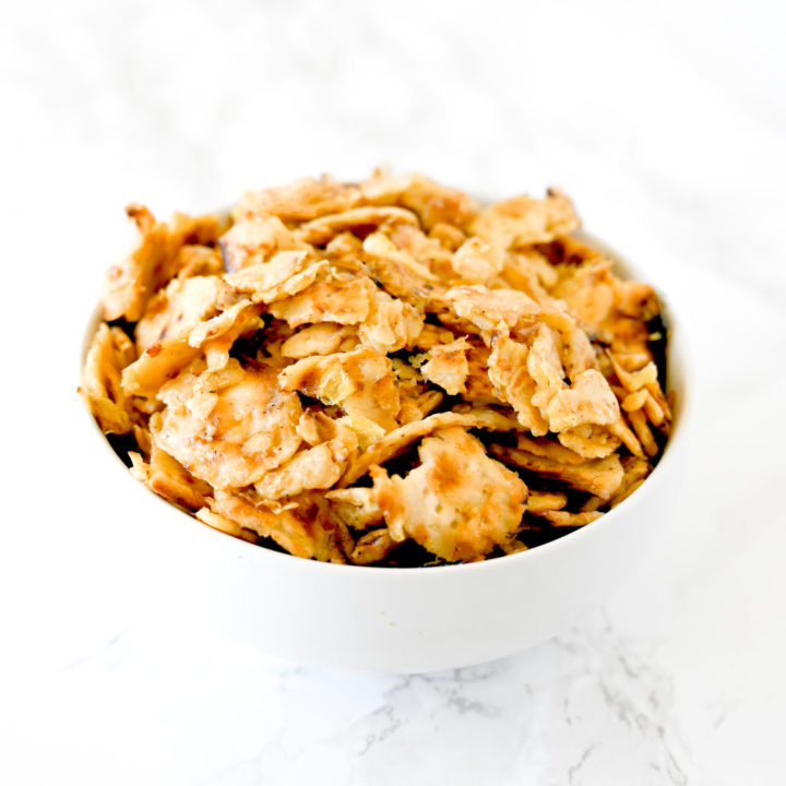 Matzo Brei in a white bowl on a white marble counter
