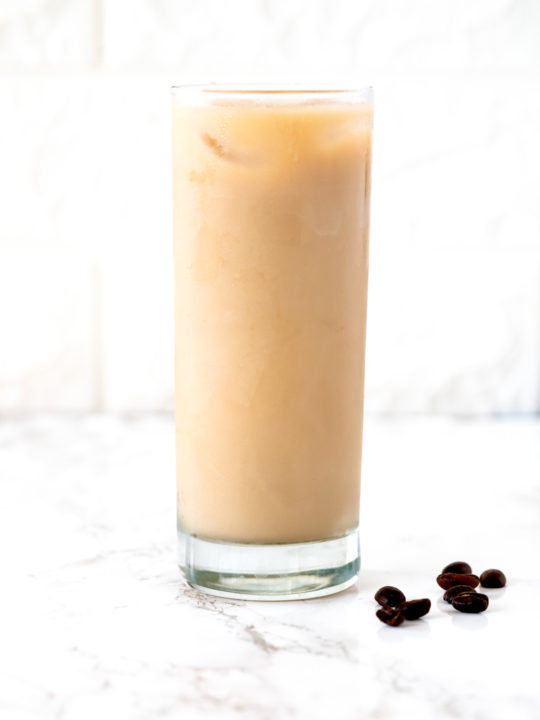 Iced coffee on a white marble counter