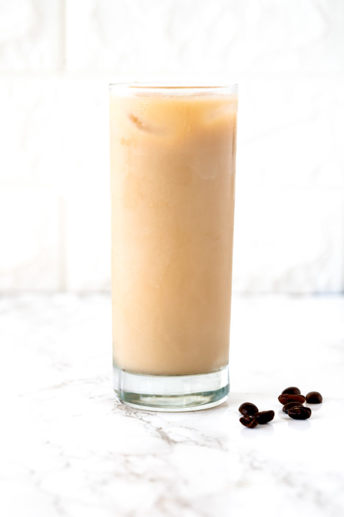 Iced coffee on a white marble counter