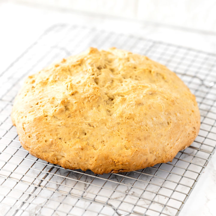 loaf of Irish soda bread on a cooling wrack