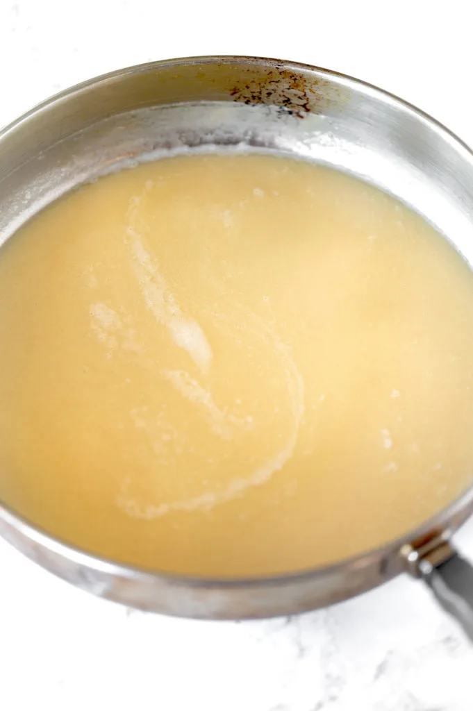 Roux with oil in pan on white marble counter