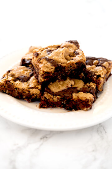 Dairy free brookies on a white plate on a white marble counter