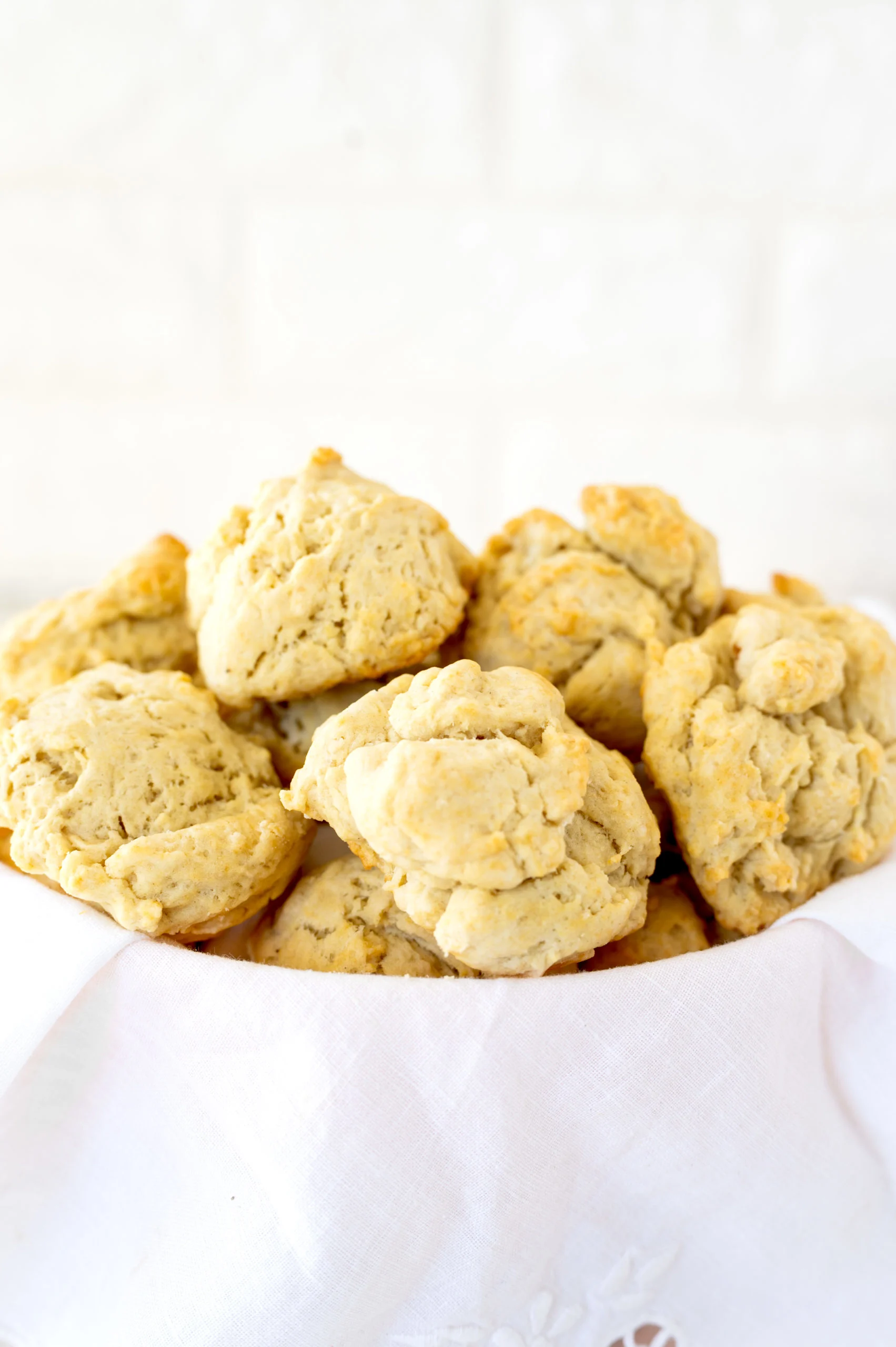drop biscuits in a bowl with a white napkin